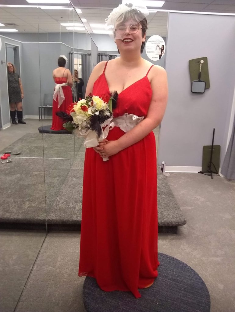 Allēna wearing her wedding dress "as red as blood" as was mentioned i "Guernica" Part 2. 